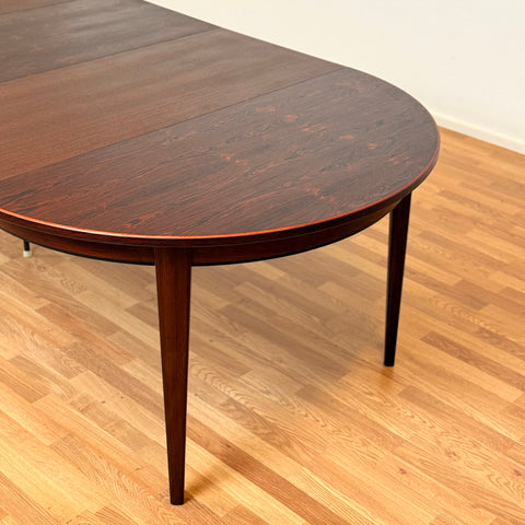 Danish round dining table in Santos rosewood by Oman Junn