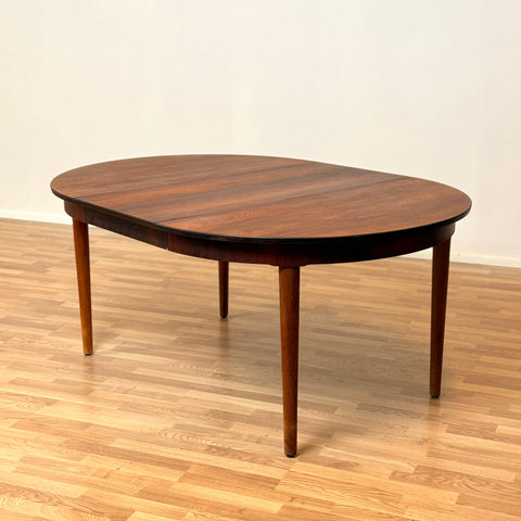 Danish round dining table in Santos rosewood