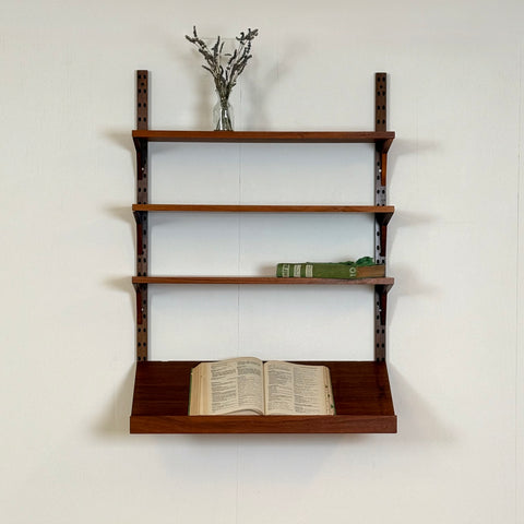 Danish wall unit / shelving system in walnut by Poul Cadovius