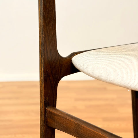 Danish dining chairs in solid stained oak by Erik Buch