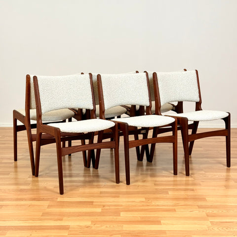 Danish dining chairs in solid walnut by Erik Buch
