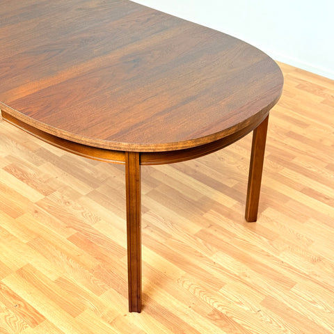 Swedish oval dining table in walnut by Bertil Fridhagen