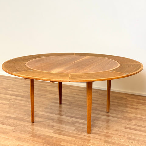 Flip-flap round dining table in oak by Dyrlund, 1970s, Denmark - Beyo Vintage
