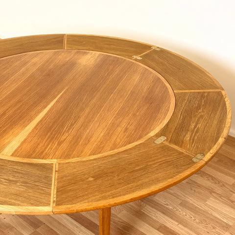 Flip-flap round dining table in oak by Dyrlund, 1970s, Denmark - Beyo Vintage