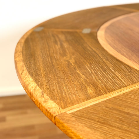 Flip-flap round dining table in oak by Dyrlund, 1970s, Denmark - Beyo Vintage